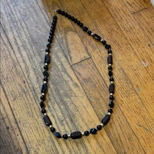 Costume jewelry black and gold beaded necklace